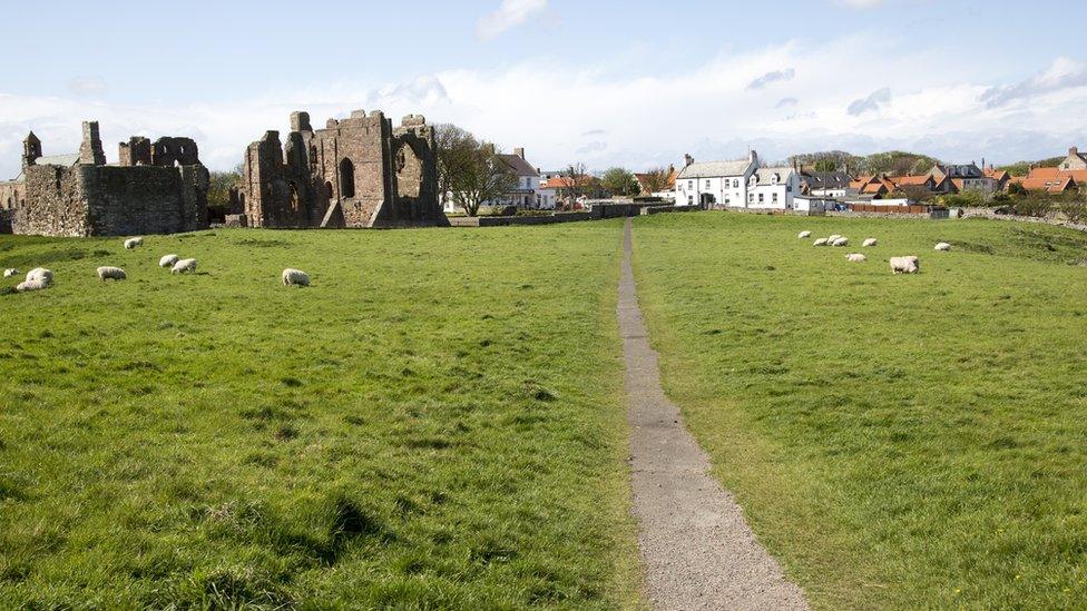 View of the priory and village