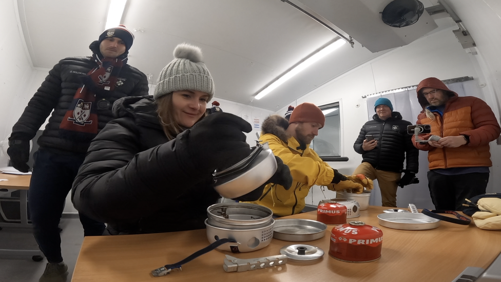 Rebecca Ricks and Sam Cox assemble stoves in -21C