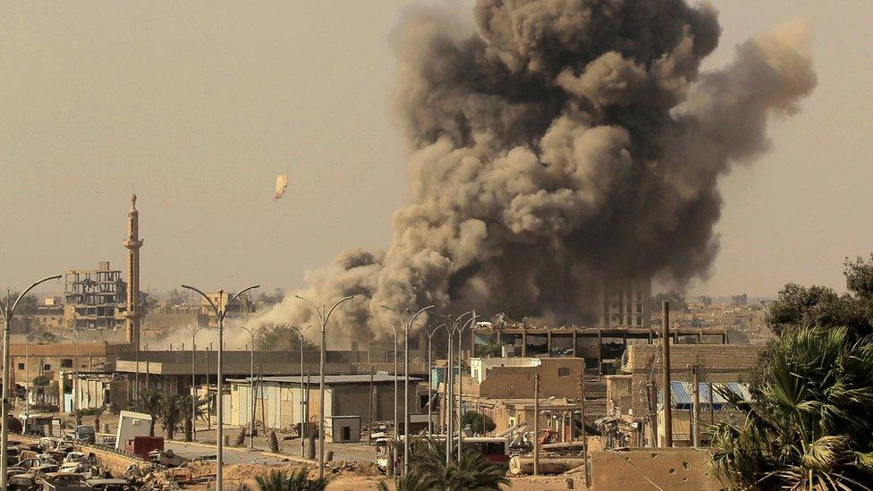 Smoke rises from Raqqa, Syria, after an air strike (15 August 2017)