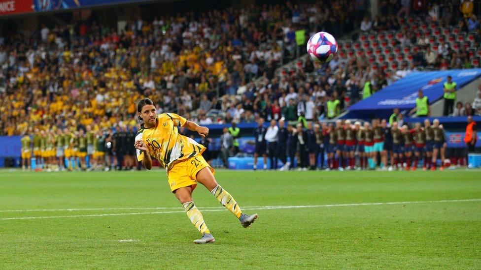 Matildas footballer Sam Kerr kicks a ball on the field at a World Cup game against Norway