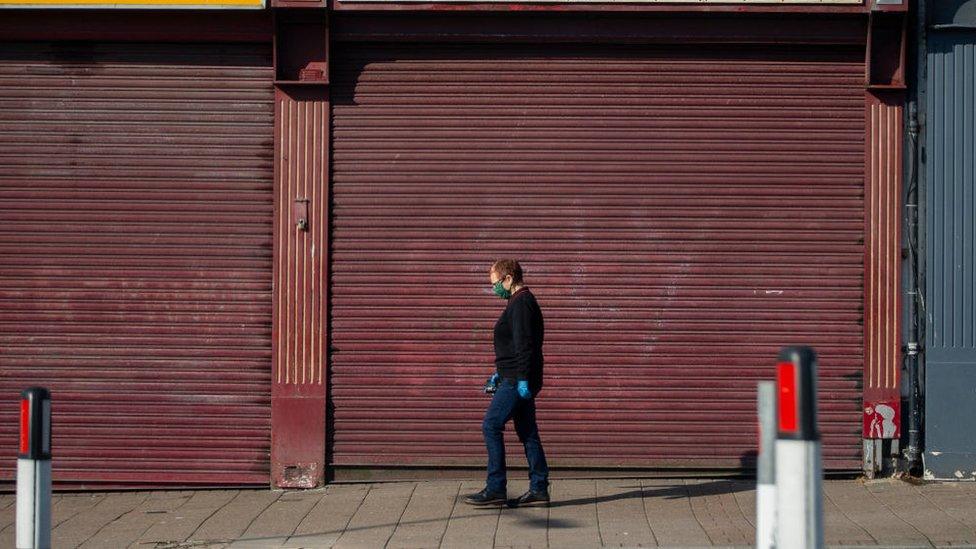 Man in front of shop