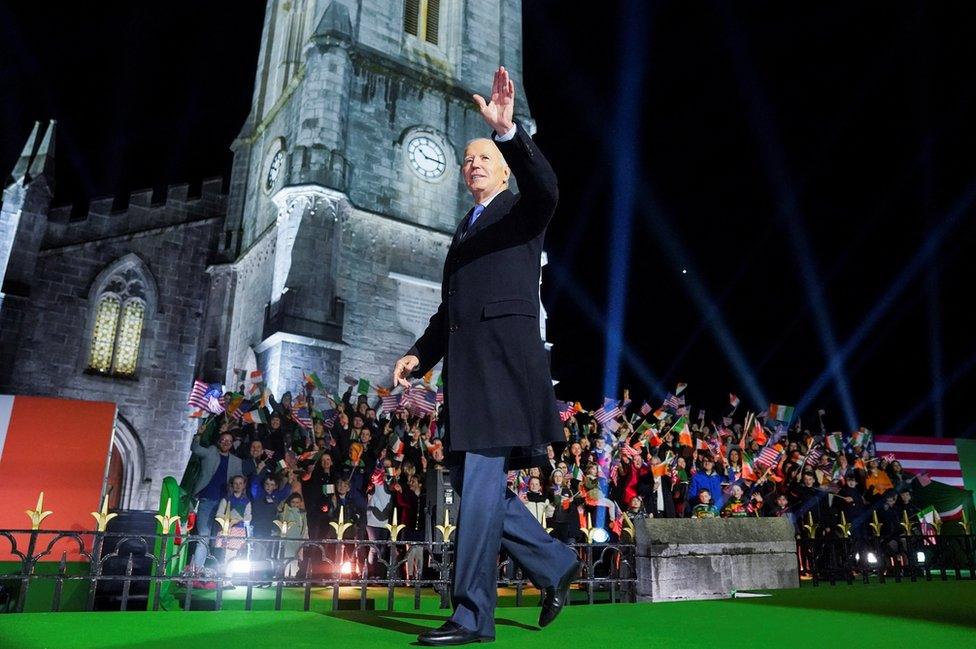 Joe Biden waves to the crowd that had gathered to watch his speech outside St Muredach's Cathedral in Ballina