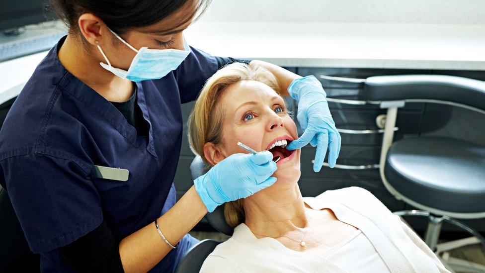 Dentist with patient