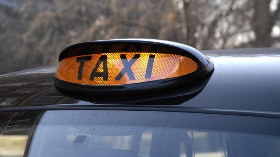 A generic illuminated taxi sign