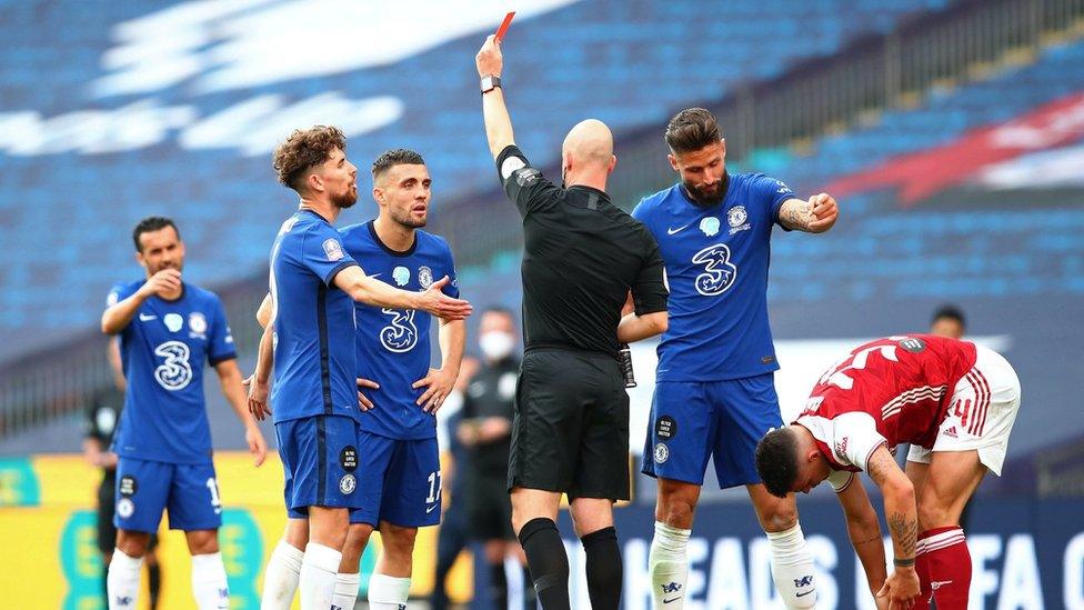 Referee Anthony Taylor awards Mateo Kovacic of Chelsea a red card, after he receives a second yellow card during the FA Cup Final match between Arsenal and Chelsea at Wembley Stadium