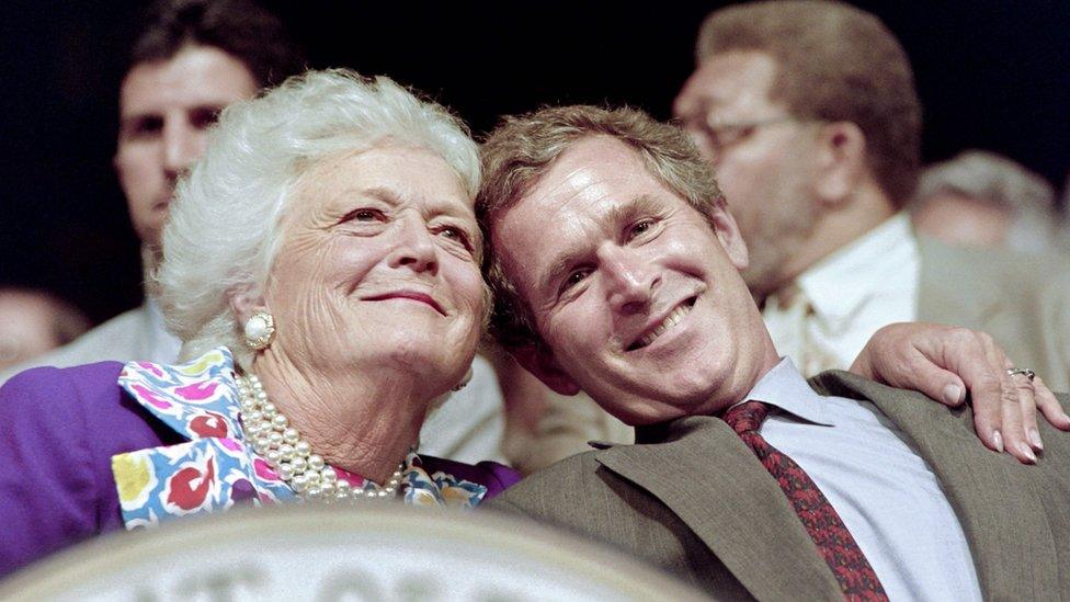 The Bush family, (L-R) Texas Governor and presidential candidate George W., Florida Governor Jeb, former US president George and his wife Barbara watch play during the Foursomes matches 25 September 1999