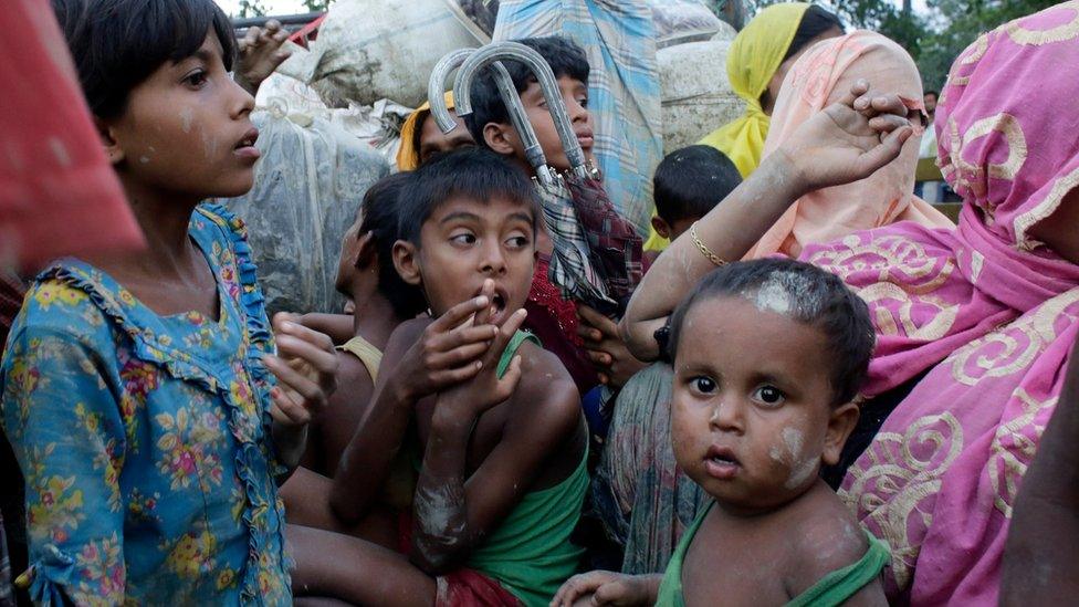 Rohingya refugees wait inside a truck as they arrive at the Bangladesh border at Teknaf, Bangladesh, 9 September 2017