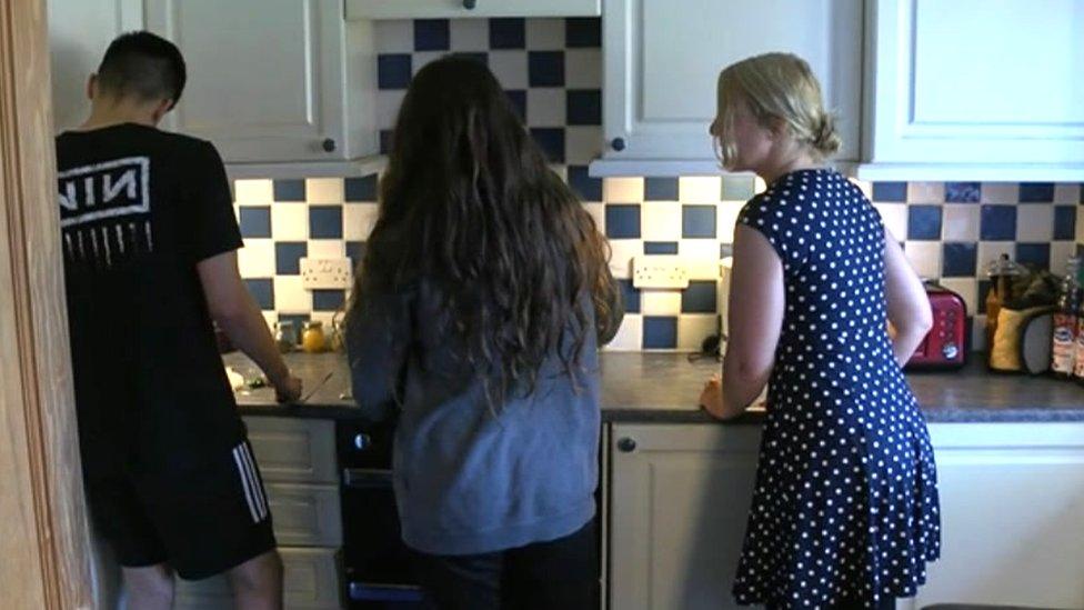 Ella Billiald cooking with her two children