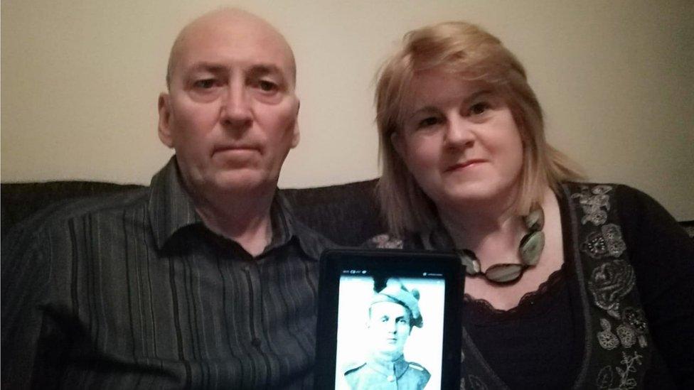 john and jane with photo of Andrew Webb