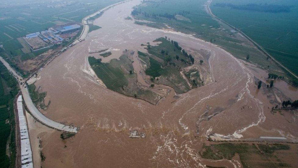 Flooded roads and fields in Hebei province, 21 July