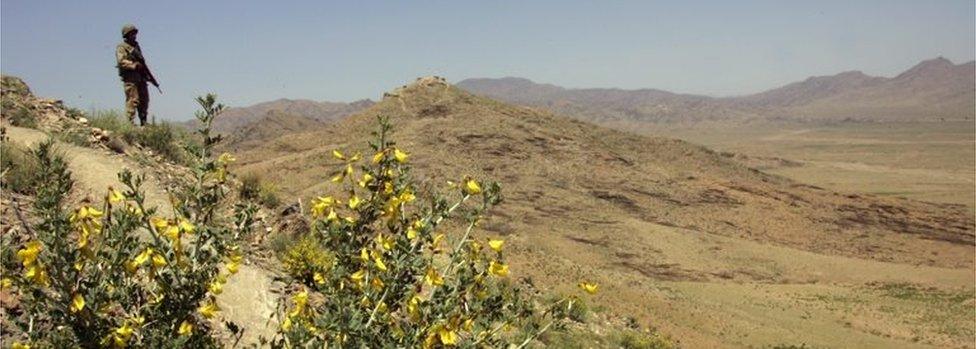 A Pakistani army soldier guards a hilltop position at a military outpost near Wana April 11, 2007 in Pakistan's South Waziristan tribal area near the Afghan border.