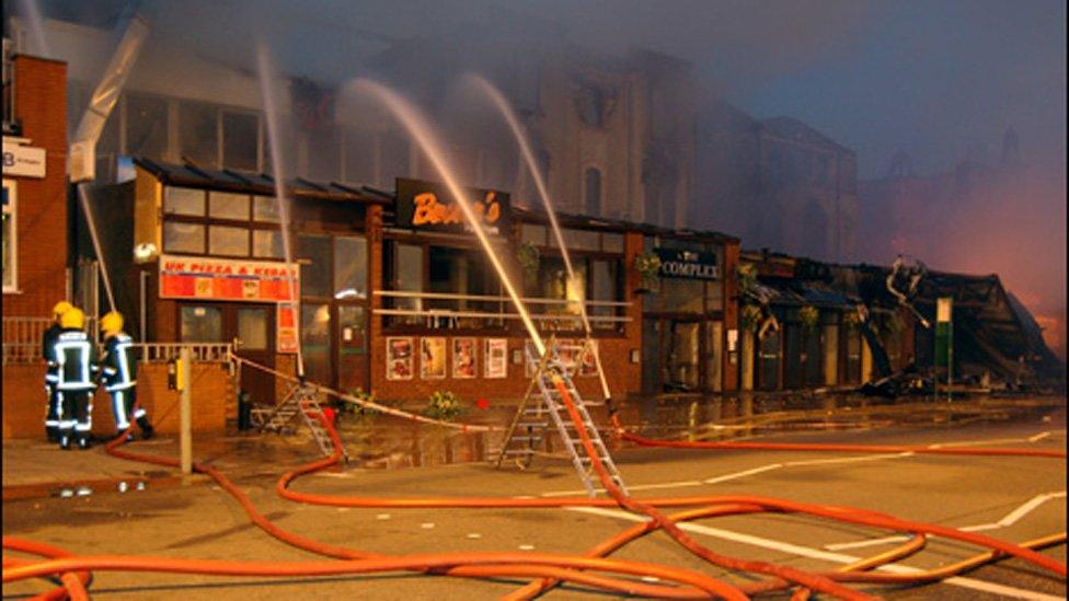 Firefighters with hoses