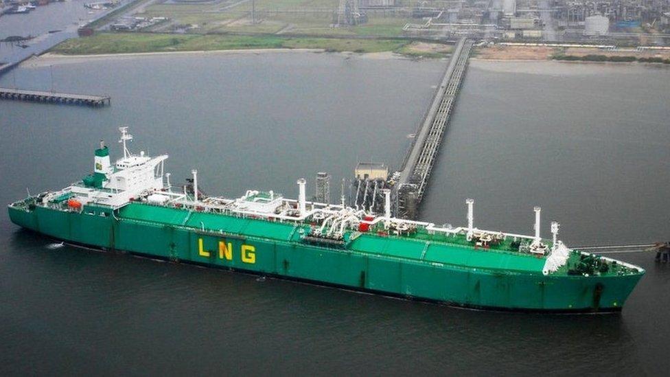 A ship loads liquefied natural gas from the Nigerian Liquefied Natural Gas plant October 12, 2004 on Bonny Island, Nigeria