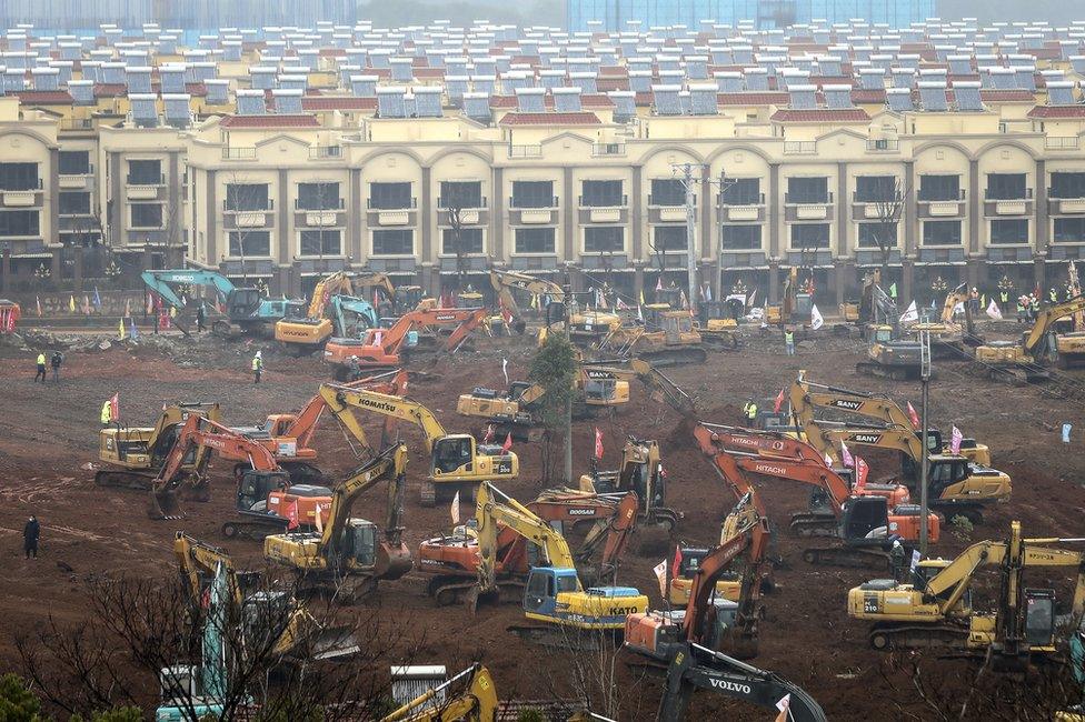 A view of cranes and diggers building Huoshenshan Hospital