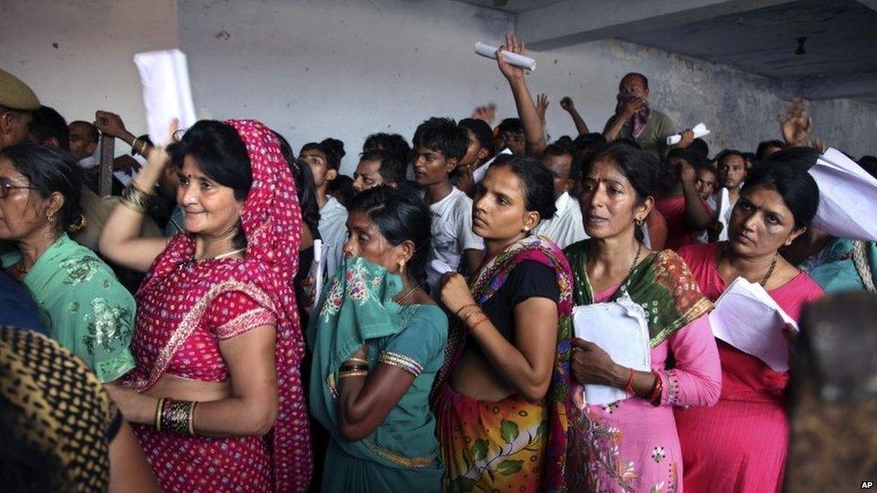 Indian Hindu devotees stand in a queue to register for a pilgrimage to the Hindu holy site of Amarnath, as others stand in a queue at the registration counter in Jammu, India, Thursday, July 2, 2015. The pilgrimage, usually referred to as Amarnath Yatra, is held annually to the holy Amarnath cave, dedicated to Hindu god Shiva.