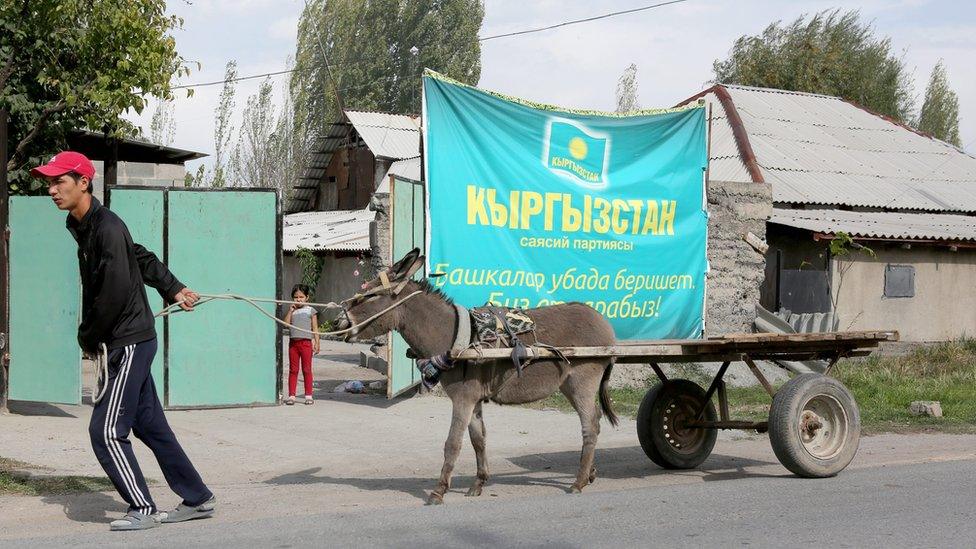 An election poster in Ala-Too village about 30 km from the capital Bishkek. Most Kyrgyz voters live in rural areas