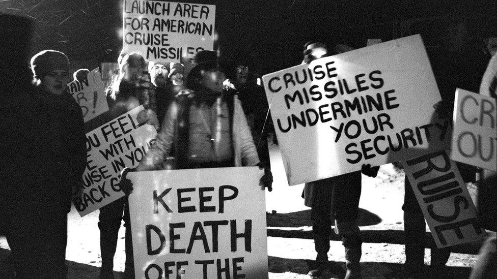 Women with protest signs