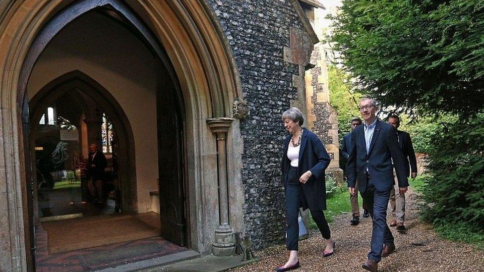 Theresa May and her husband Philip attending a church service in her constituency