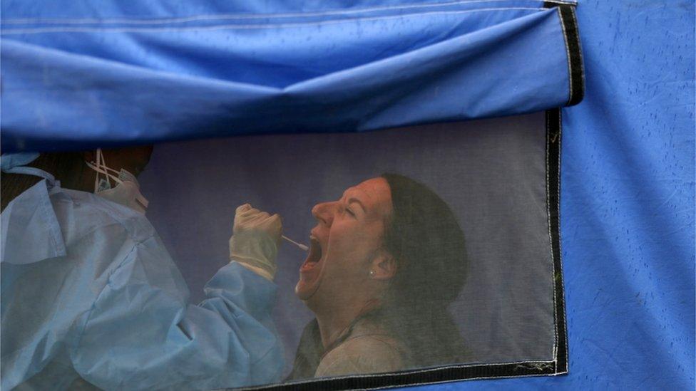 A traveller is tested for the coronavirus disease amid a nationwide COVID-19 lockdown, at the Grasmere Toll Plaza in Lenasia, South Africa. Photo: January 2021