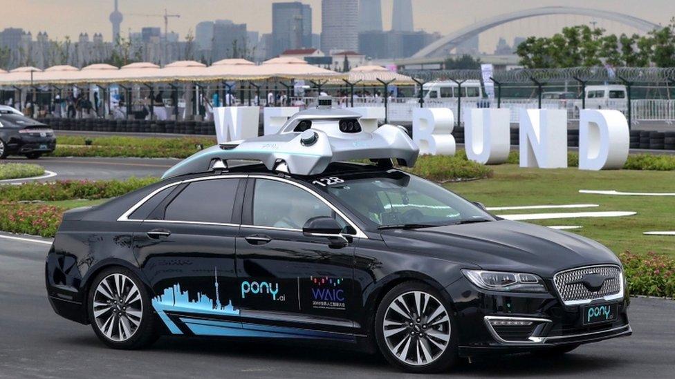 A driverless car by Pony.ai makes its way during the World Artificial Intelligence Conference 2018