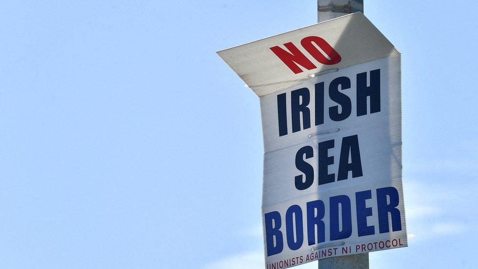 A poster reading "no Irish Sea border" at the port in Larne, County Antrim