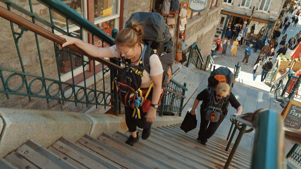 The pair climbing stairs during the challenge