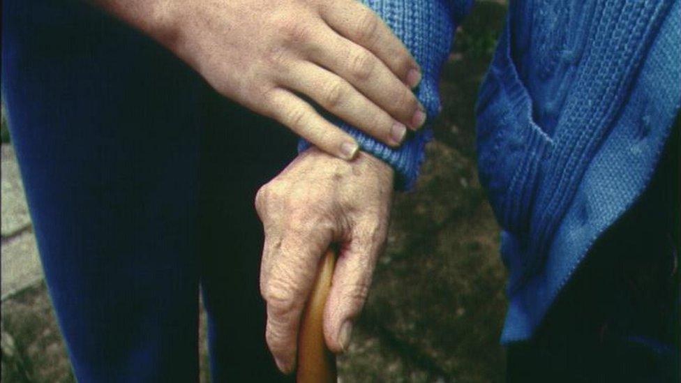 Elderly person with carer