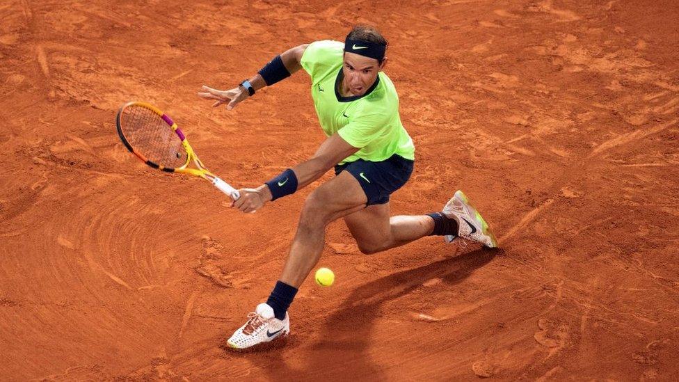 Rafael Nadal of Spain in action against Novak Djokovic of Serbia during the semi finals of the French Open singles competition in 2021