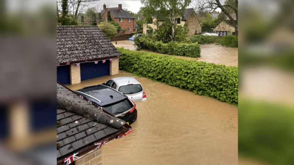 The water flooding a driveway