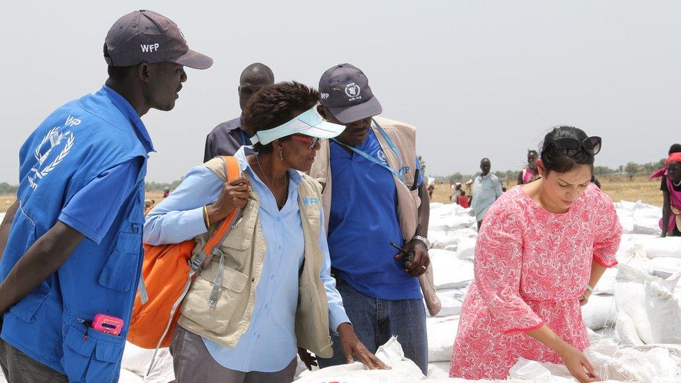 The UK's international development secretary, Priti Patel, inspecting aid sacks