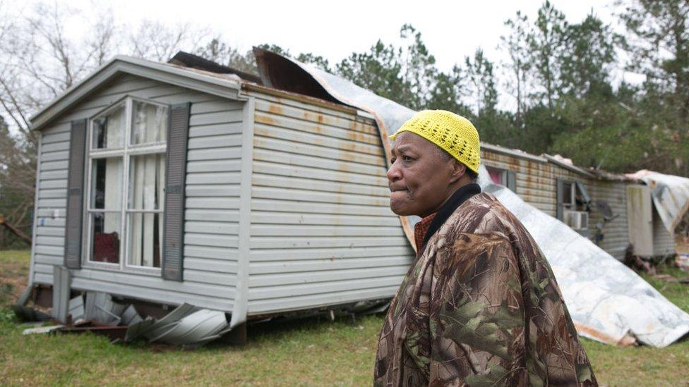 resident views their ruined home