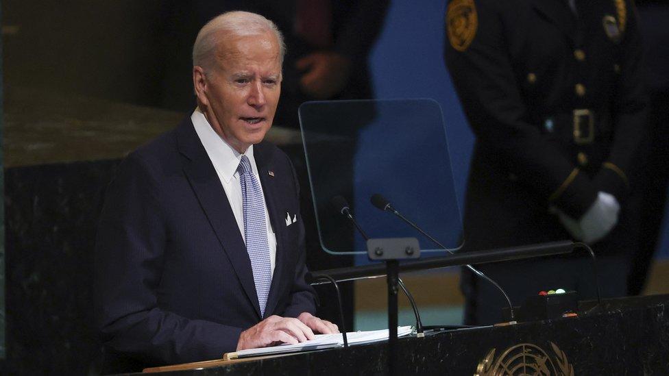 joe biden speaking at a podium