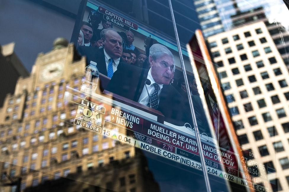 Mueller testimony on a TV screen in Times Square, New York City