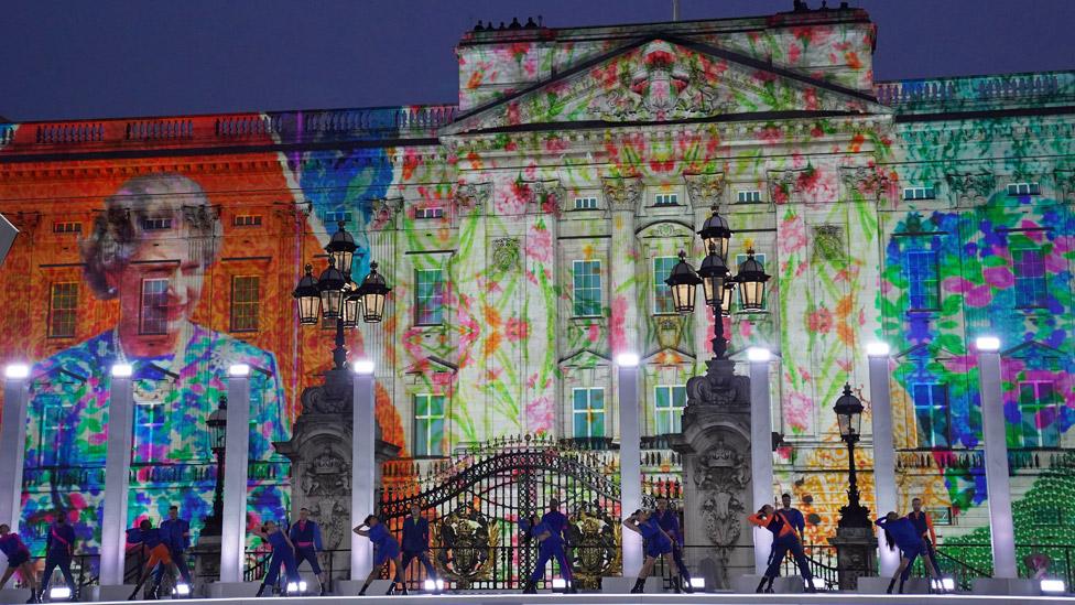 Images of the Queen were projected onto the front of the palace