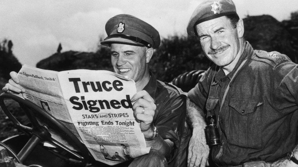 Brig Jean Allard, commanding officer of the Canadian Brigade, breaks the news of a truce in the Korean war to Col K L Campbell, commander of the 3rd battalion of the RCRS, on 2 August 1953