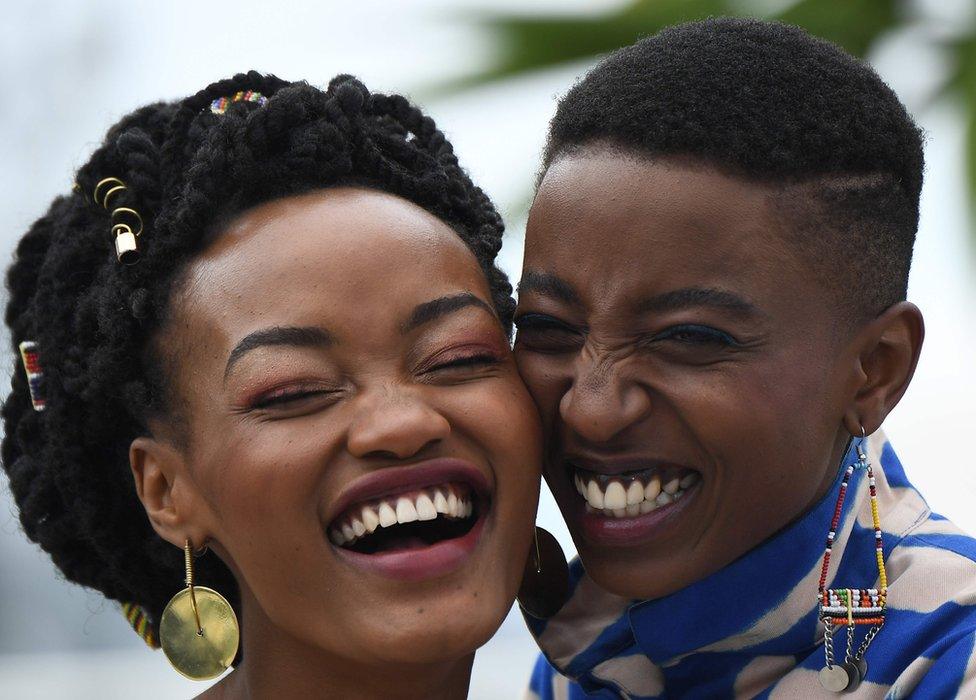 Kenyan actress Sheila Munyiva (L) and Kenyan actress Samantha Mugatsia pose on May 9, 2018 during a photocall for the film "Rafiki" during the 71st edition of the Cannes Film Festival in Cannes, southern France