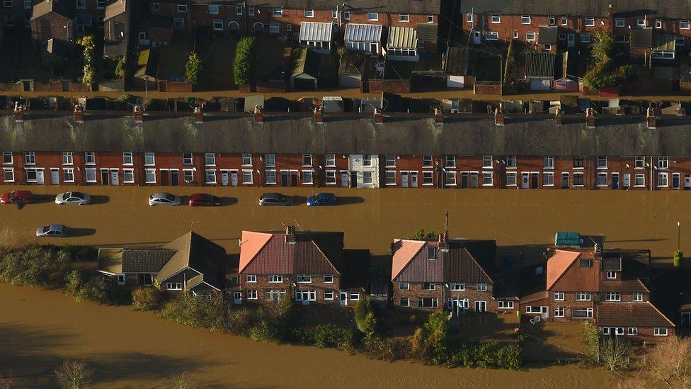 Row of houses with flooded water