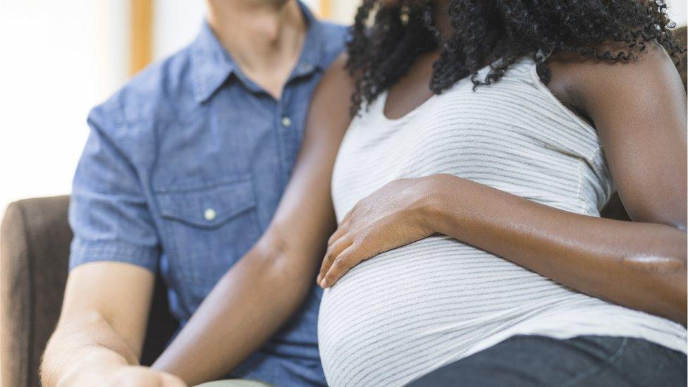 Pregnant black woman and her partner