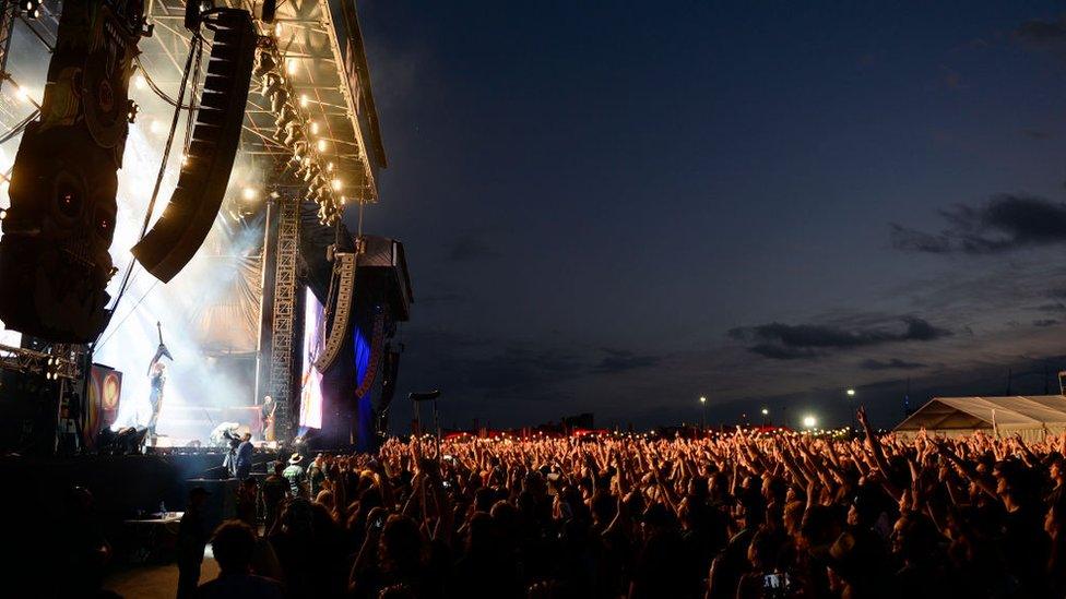 A wide view of a stage and crowd at a music festival in Melbourne