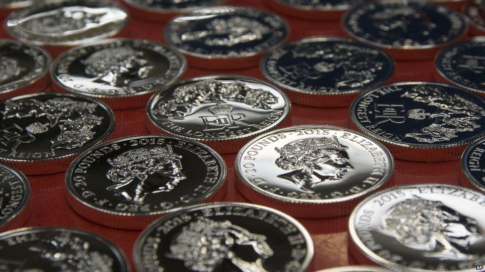 Queen Elizabeth's face on lot of coins