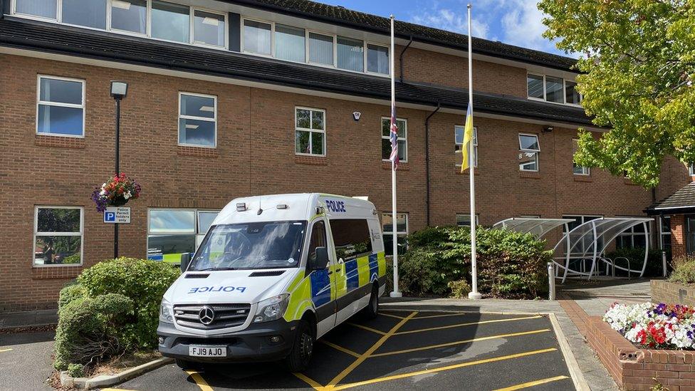 Flags at half-mast outside Beeston police station