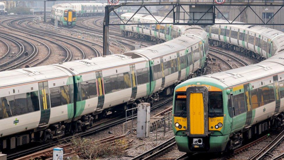 Regional and commuter trains seen passing to and from Victoria station