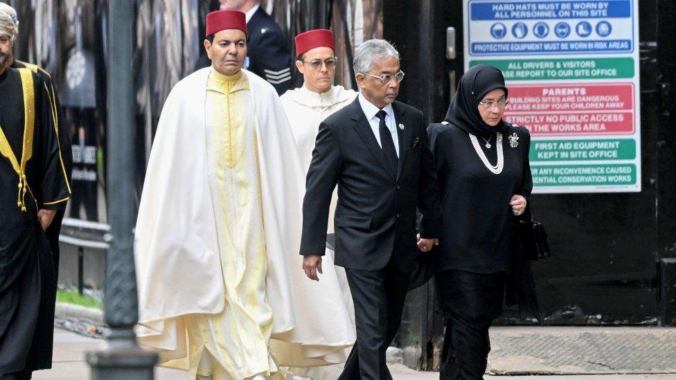 His Majesty Yang di-Pertuan Agong Al-Sultan Abdullah Ri'ayatuddin Al-Mustafa Billah Shah of Malaysia and Her Majesty Raja Permaisuri Agong Tunku Hajah Azizah Aminah Maimunah Iskandariah of Malaysia at Westminster Abbey