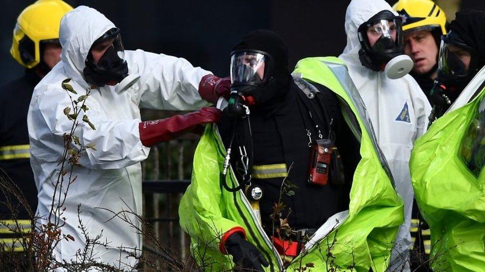 Members of the fire brigade in biohazard suits in Salisbury