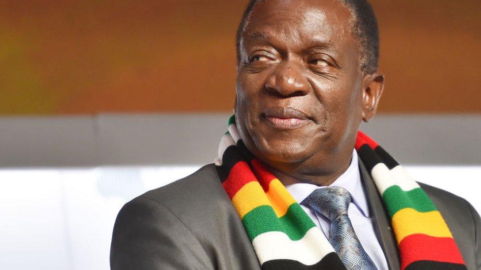 Zimbabwean President Emmerson Mnangagwa in a scarf in the colours of Zimbabwe's flag