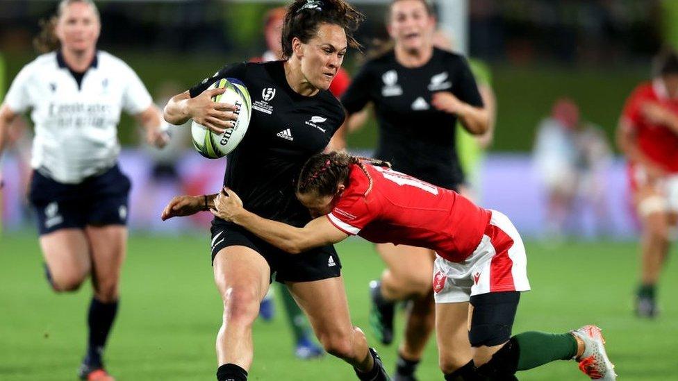 Portia Woodman evades the tackle of Jaz Joyce