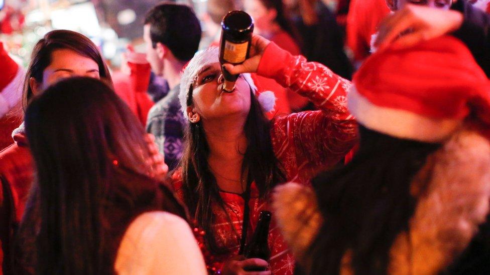 Revellers take part in SantaCon on December 10 2016 in New York