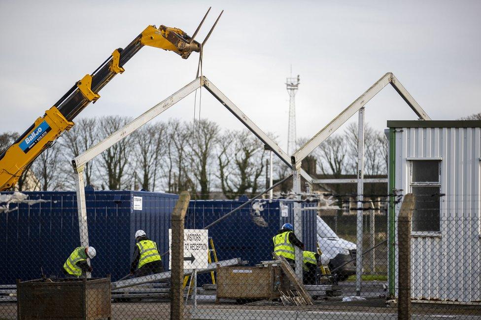 Construction workers build a border control post at Larne Harbour