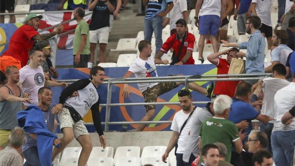 Fans clash inside the stadium