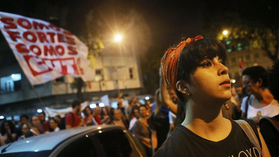 Protesters walk at a march against interim President Michel Temer on May 20, 2016 in Rio de Janeiro, Brazil.